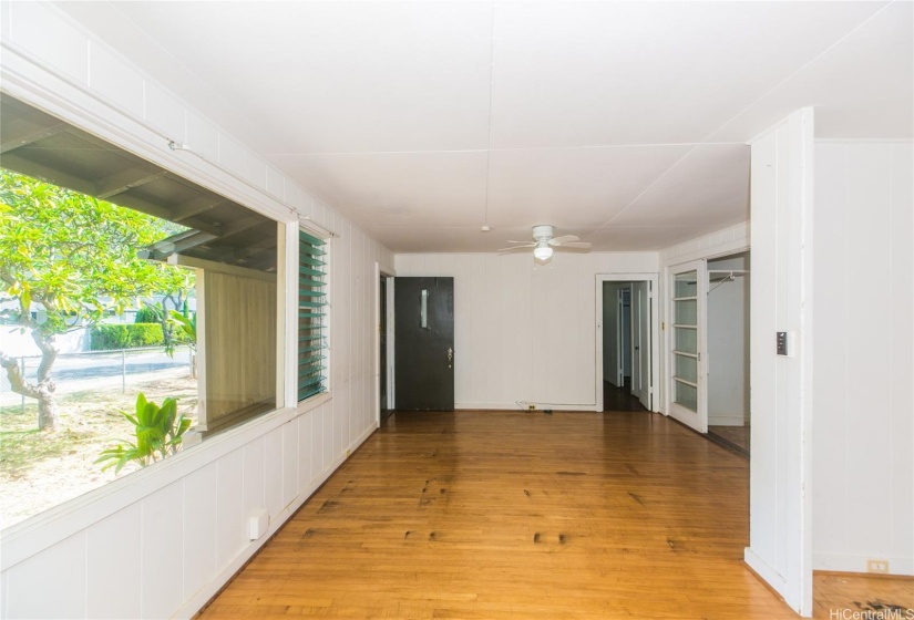 Front entry into the living room with large, picture windows for maximum natural light.