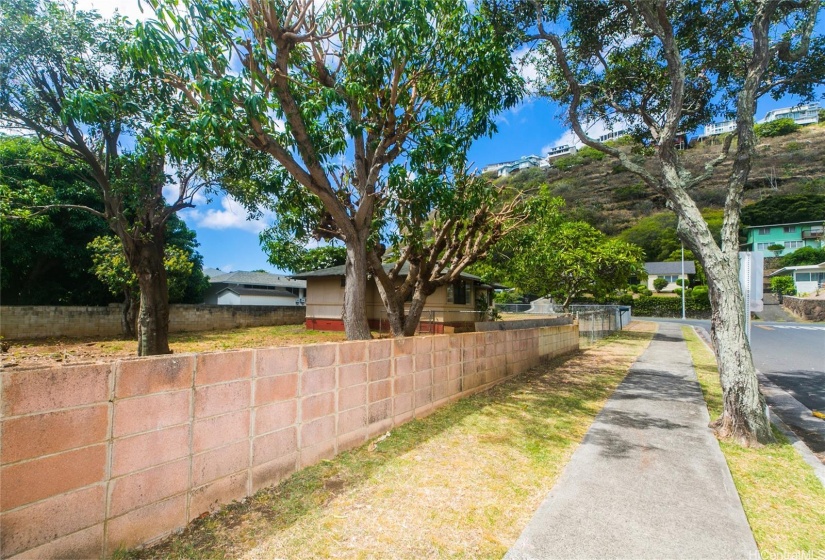 Mature trees dot the landscaping to provide shaded areas to enjoy.