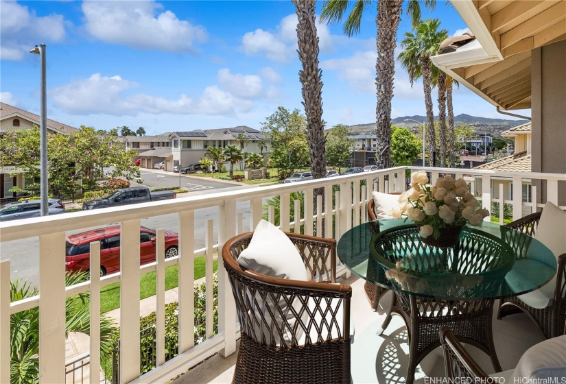 Lanai with mountain views. Virtually staged. Enhanced photo.