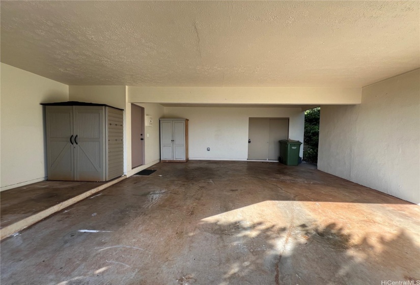 Garage with lots of extra storage space.