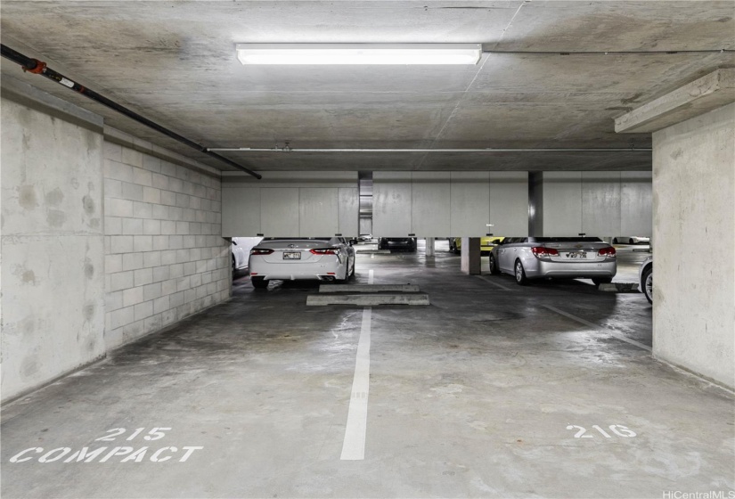 Two parking stalls with overhead storage.