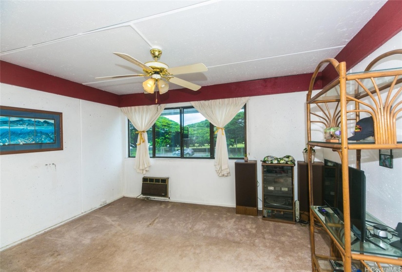 Living room is spacious with a view.