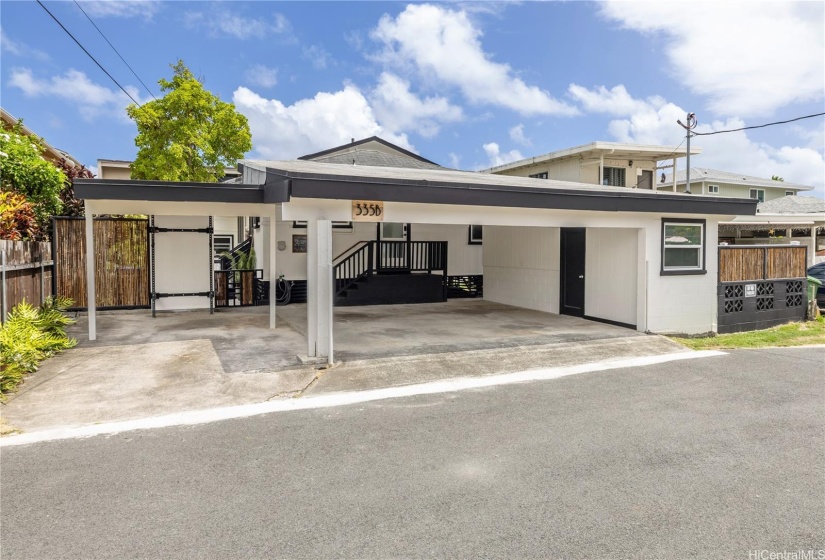 On the right side of the 3-car carport is a storage room and behind that, with its own door, is a beach bathroom with shower.