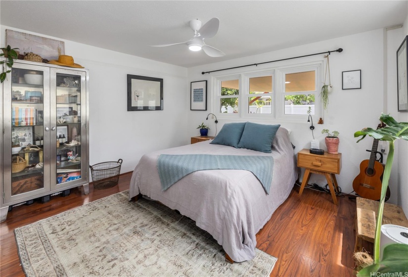 The main floor has two bedrooms. The windows in this room look out to the garden.