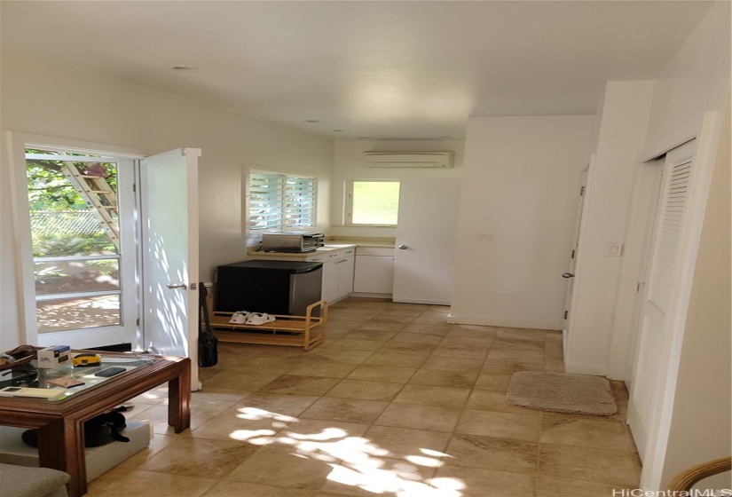 Looking back at the entry door and the kitchenette area.