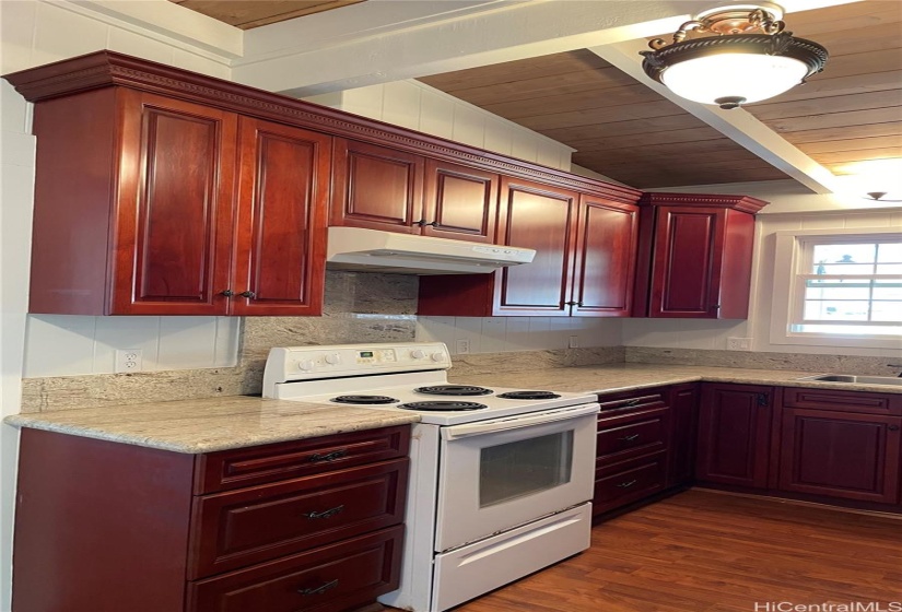 Kitchen has tons of cabinet space.