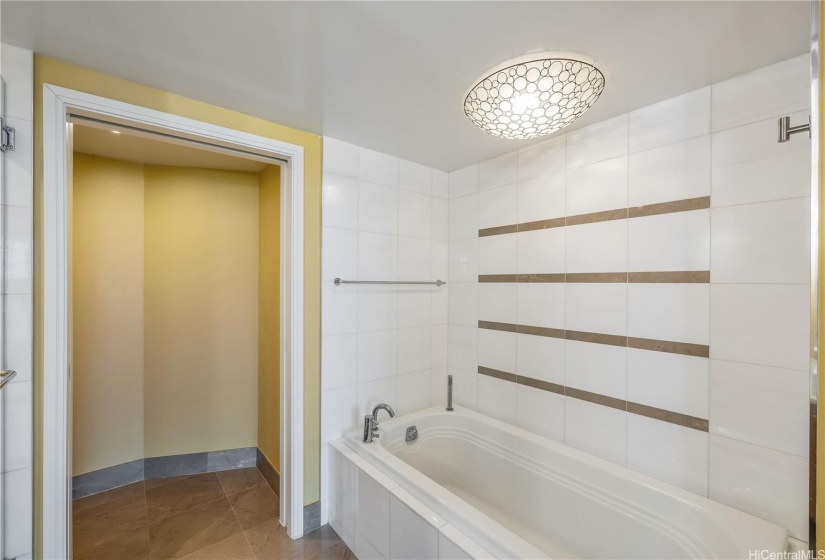 The Primary Bedroom en-suite Bathroom includes a large soaking tub.