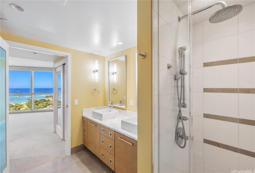 Magnificent ocean view can be enjoyed from the En-Suite Bathroom of the Primary Bedroom. The bathroom includes both a soaking tub and a walk-in shower.