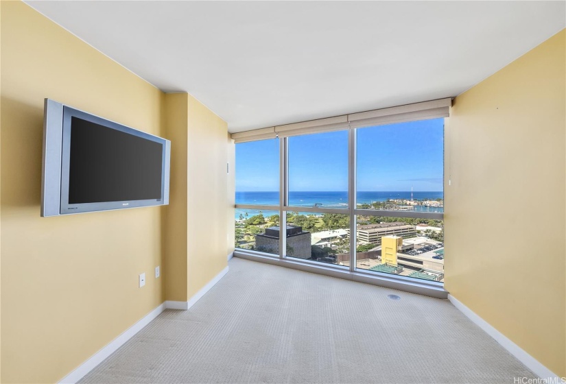 Primary Bedroom wall-to-ceiling windows with ocean view.