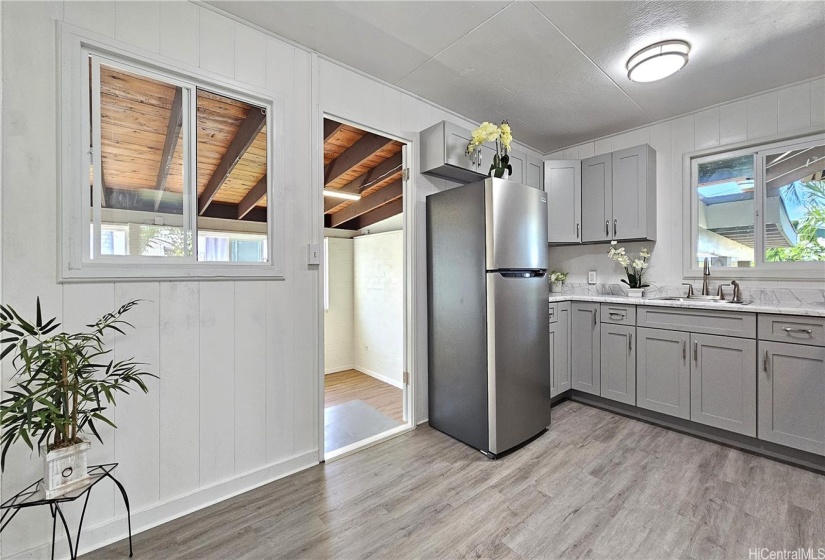 Kitchen door exits to lower level living room