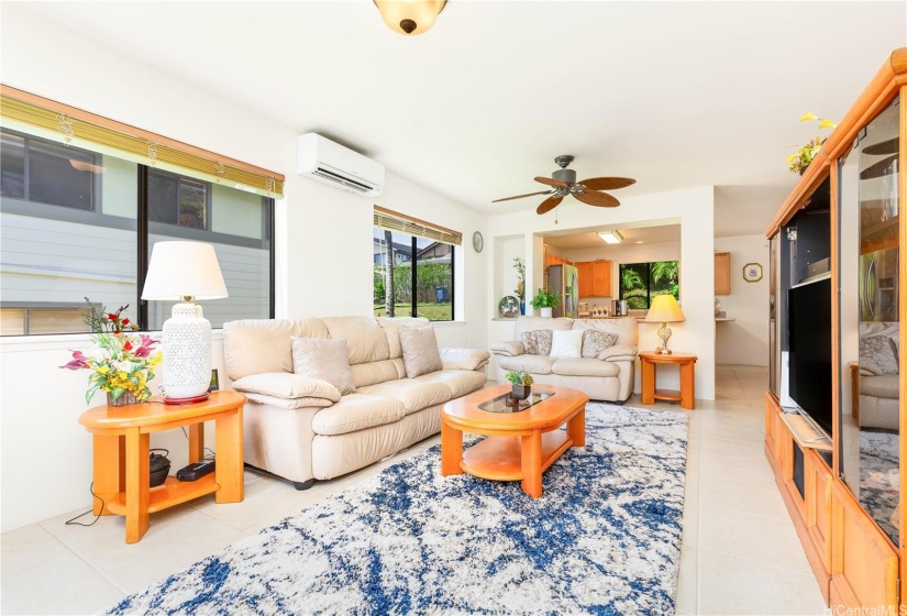 Front door entry into living room with view into kitchen & dining area. Perfect open floor plan for entertaining!