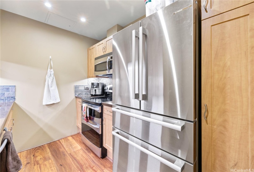 Newer stainless steel refrigerator and appliances.