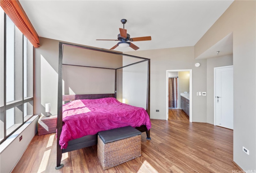 Spacious primary bedroom with two closets.