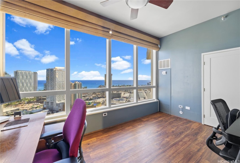 Second bedroom with views of the ocean and city.
