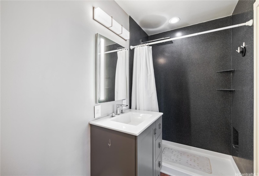 Second en suite full bath with updated shower and vanity.