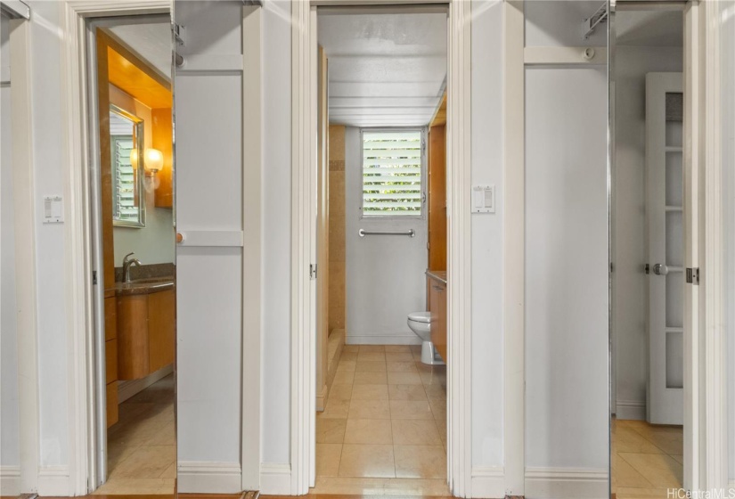 storage/closet corridor between bedroom and bathroom