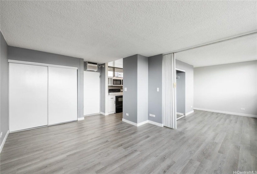 View of dining/living room area and bedroom