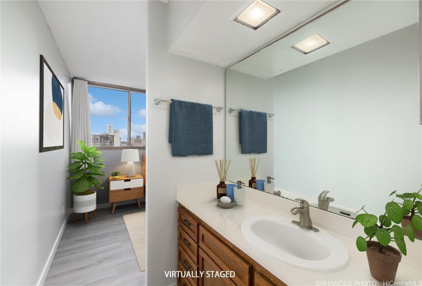 Enhanced Photo of vanity area looking towards the bedroom