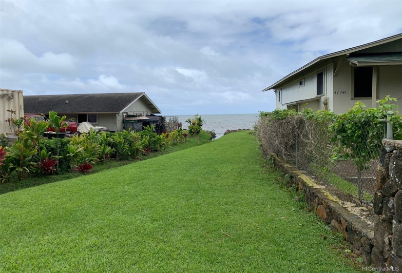 This is the access lot that goes from Kamehameha highway to the ocean.  This lot is included in the sales price of the lot.