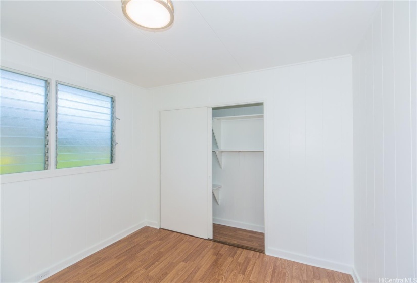 Bedroom 2 with built in closet system.