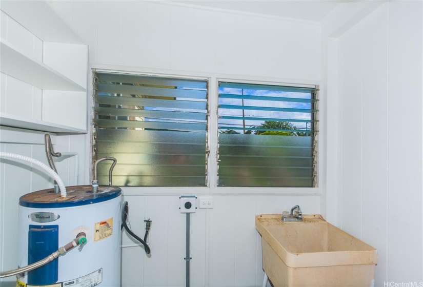 Washroom with updated electrical ready for your washer and dryer.