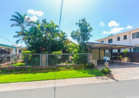 Front of home with beautiful landscaped plants.