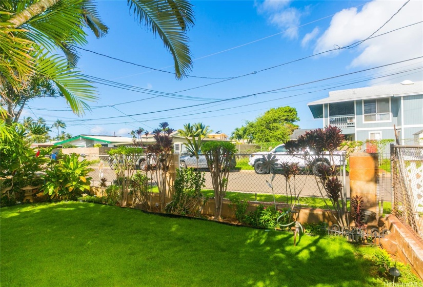 Beautiful fenced in front yard.