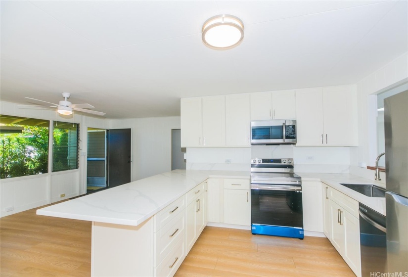 Newly remodeled beautiful white kitchen with new stainless steel appliances.