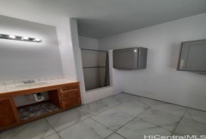 Full bathroom, tiles shower, and ceramic tile flooring.