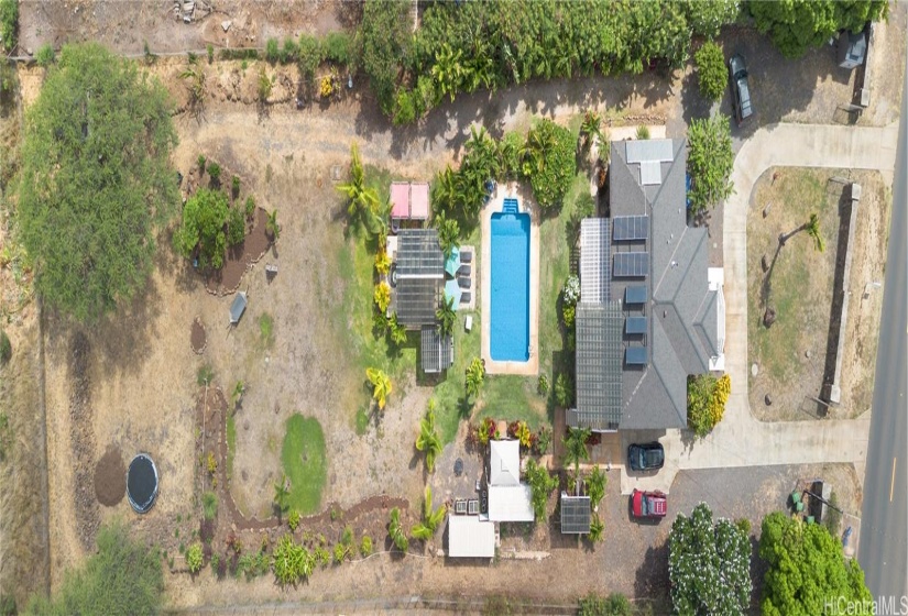 1.18 acres of land, pool, solar, and so much opportunity.