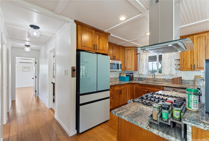 Gas stove and high-end appliances make this kitchen the center of the home
