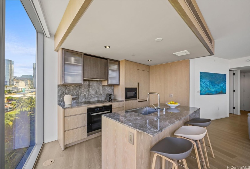 Kitchen with eat-in island seating area.