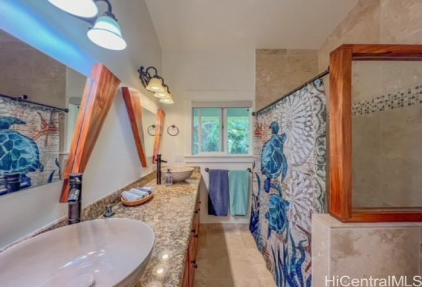 Wood outline primary bath with a huge shower and double vessel sinks