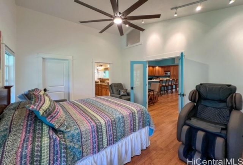 Guest bedrrom has frosted double doors to the living area