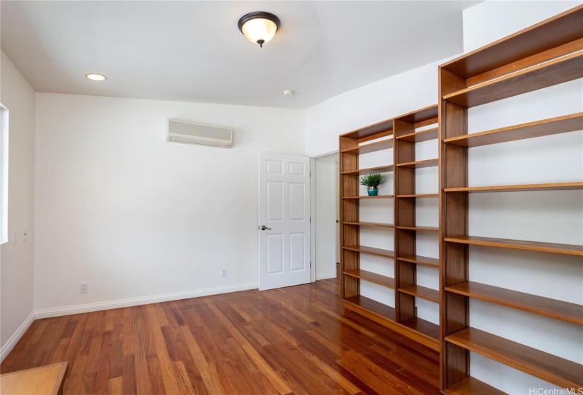 Great room for office/den/bedroom with built in bookshelves.