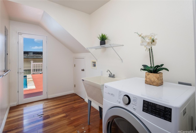 A separate laundry room downstairs is another wonderful feature.  There is a spacious closet where the small door is, and the door leads out to the pool so swimmers have easy access!