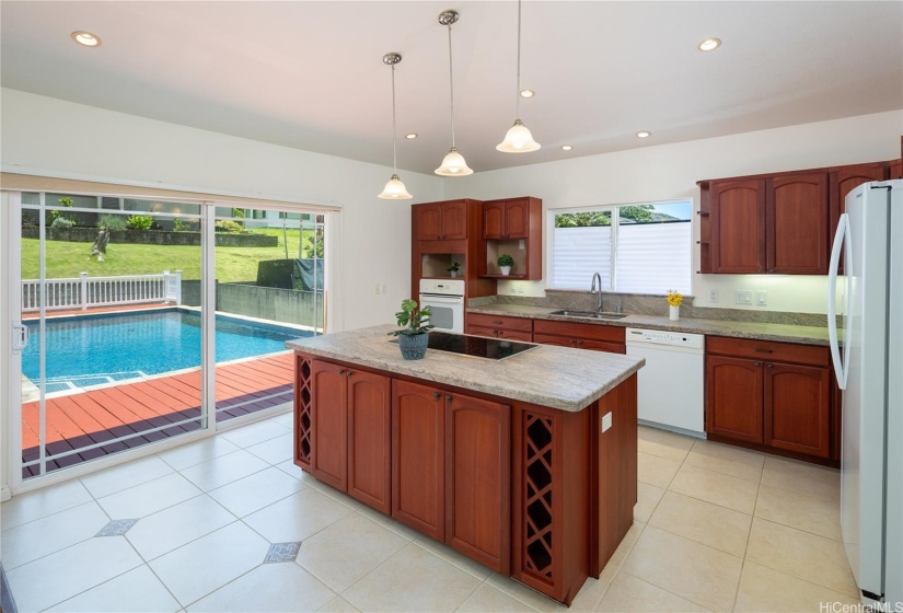 Open kitchen area flows to pool deck offering great entertaining possibilities