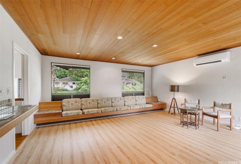 Seating in the great room, and more storage behind the long bench. Redwood ceilings.