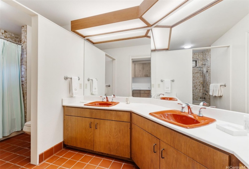 Hall bath that serves 3 bedrooms. Next to the laundry room.