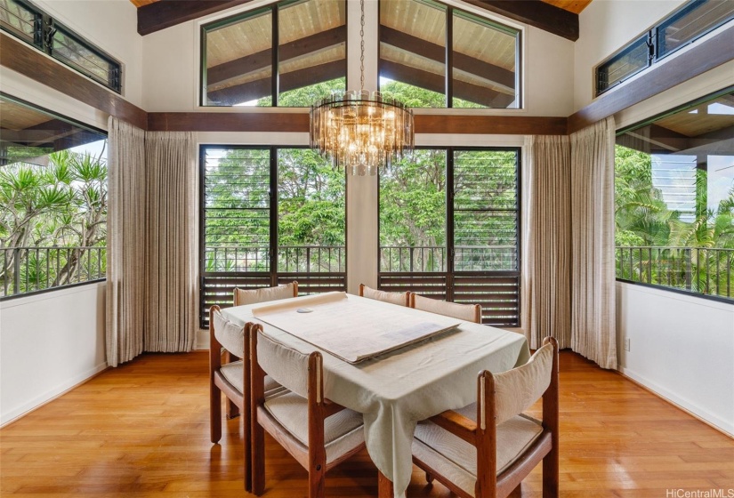 Dining area with kitchen next to it with bar and easy conversation from dining to kitchen