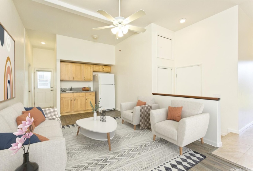 This versatile flex room on the first floor comes equipped with a wet bar and a full bathroom, offering additional living space or entertainment options. Photo is virtually staged.