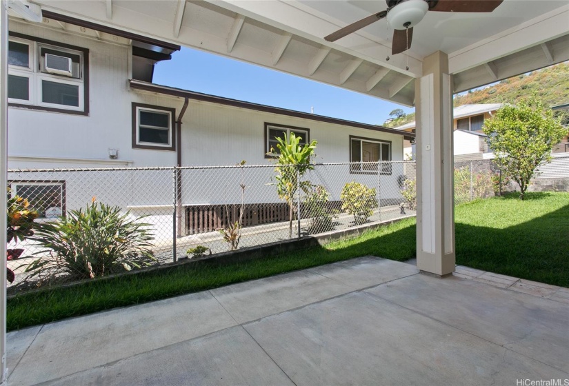 Enjoy outdoor living in this large, covered patio area with a ceiling fan and 128 square feet of comfortable space  with direct access from the 