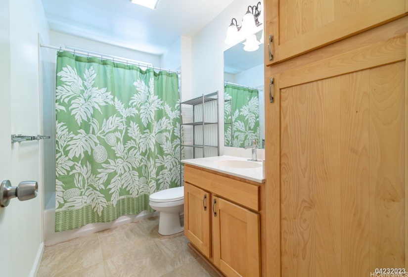 The large bathroom in the Ohana unit includes extra storage space for added practicality.