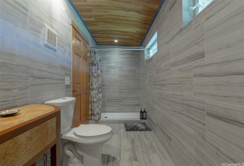 Guest studio full bath, completely tiled from floor to ceiling.