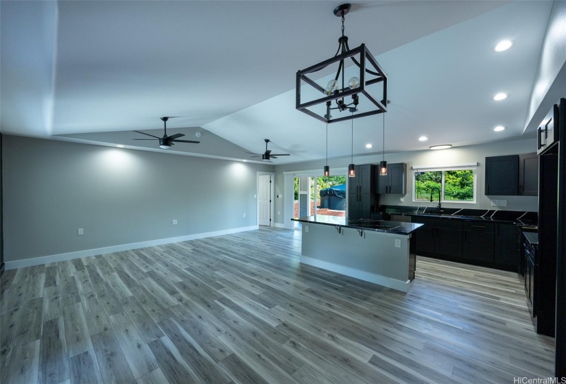 Sliding glass doors from the kitchen area to the rear lanai make grilling a snap!