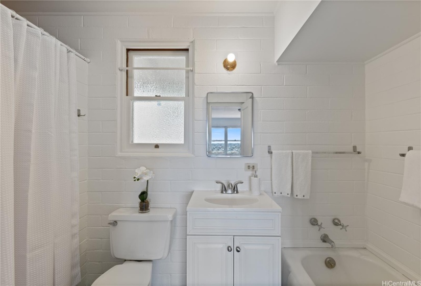 Ensuite Primary Bathroom with separate shower on left + bathtub on right