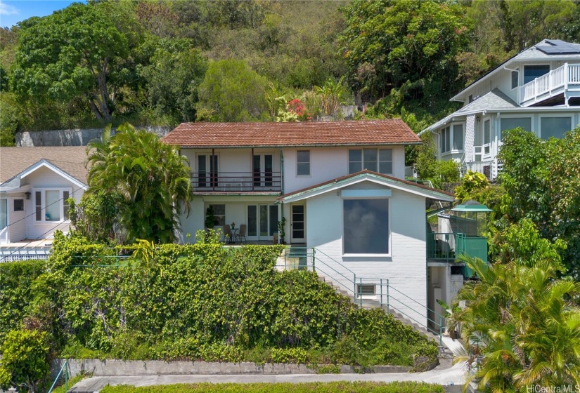 This lovely Mid Century Modern home is built on naturally terraced, solid bedrock, on the desirable North side of Manoa, with the front beautifully landscaped, one can plant a huge garden galore in the backyard,  that's also terraced!