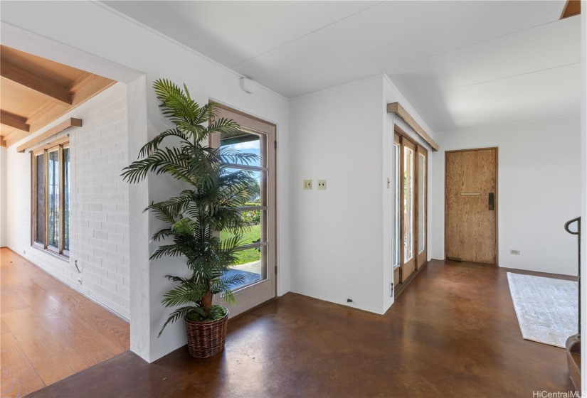 Foyer from inside the front door, between the Livingroom, dining and wide stairs to upstairs bedroom