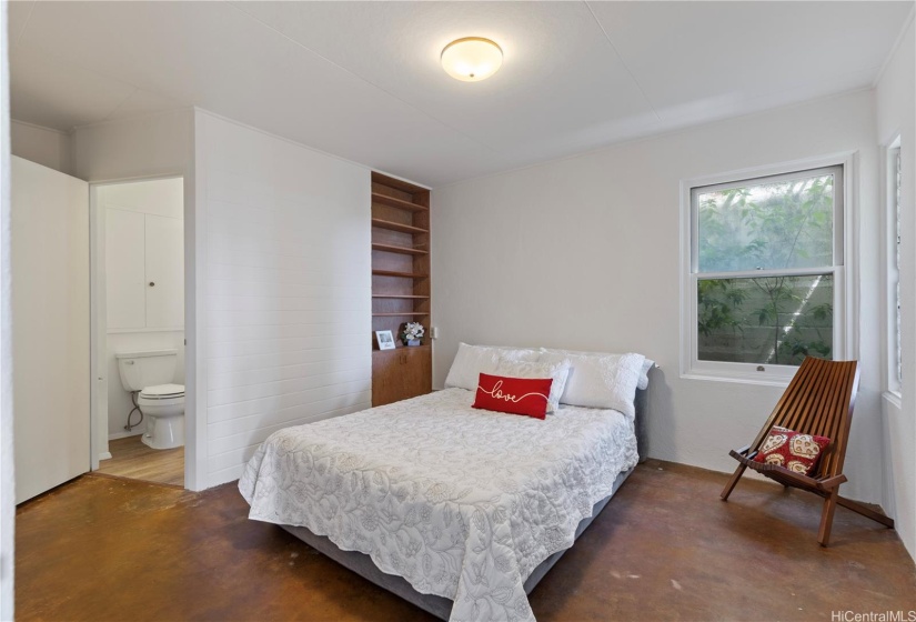 Just inside the front door, next to the Living room, is a Guest bedroom which can also double as an Office, with ensuite bathroom.