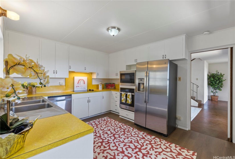 Large Mid-century modern kitchen with new, XL stainless steel stove & refrigerator
